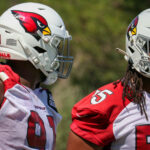 Arizona Cardinals DL L.J. Collier and Dante Stills chat during minicamp on Tuesday, June 13, 2023, in Tempe. (Tyler Drake/Arizona Sports)
